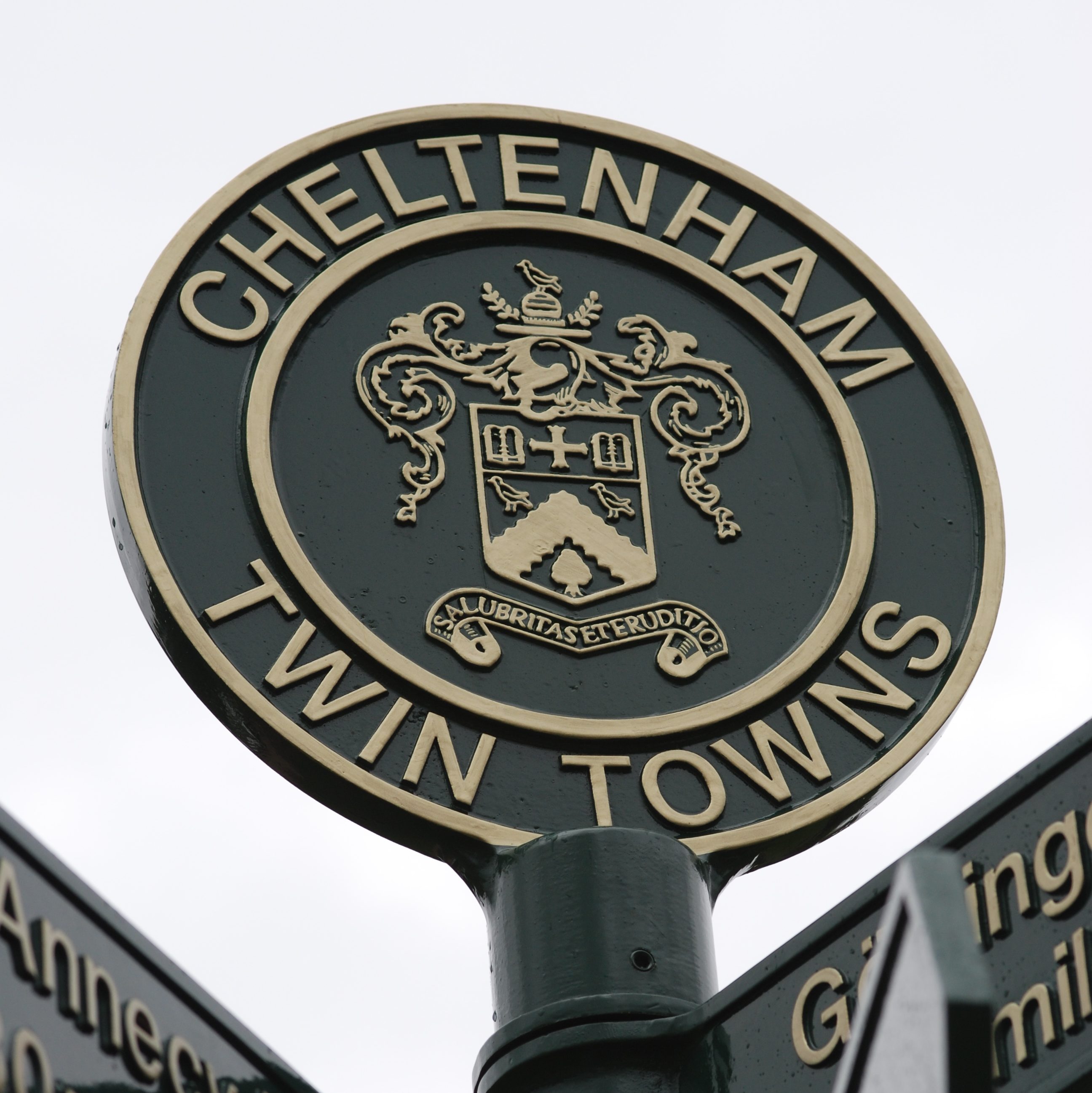 Close up view of the top of Cheltenham's twinning signpost